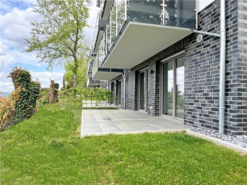 Moderne 2 Zimmer-Wohnung mit großzügiger Süd-/Westterrasse, Garten, Fahrstuhl und Garag